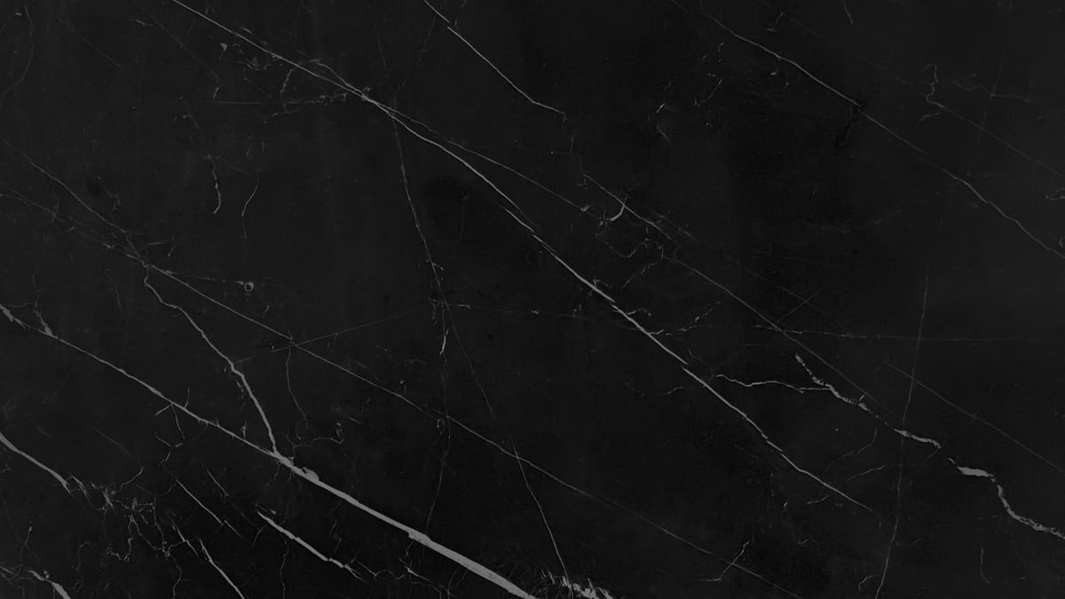 Verdant dark black marble background with intricate white mineral veins, showcasing a luxurious and elegant natural stone texture for design, architectural concepts or decorative.