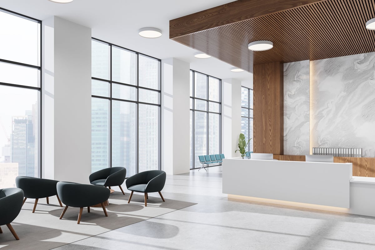 Modern office lobby with contemporary furniture and marble reception desk, wood ceiling panels, and large city-view windows. 3D Rendering